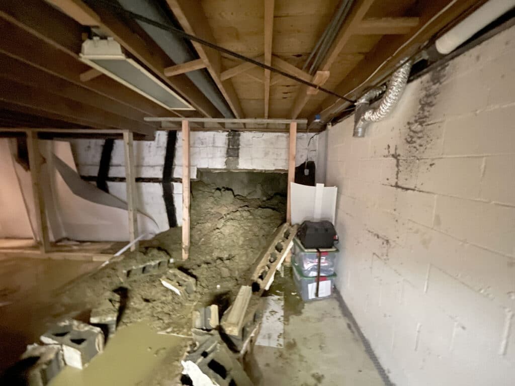 Collapsed basement wall