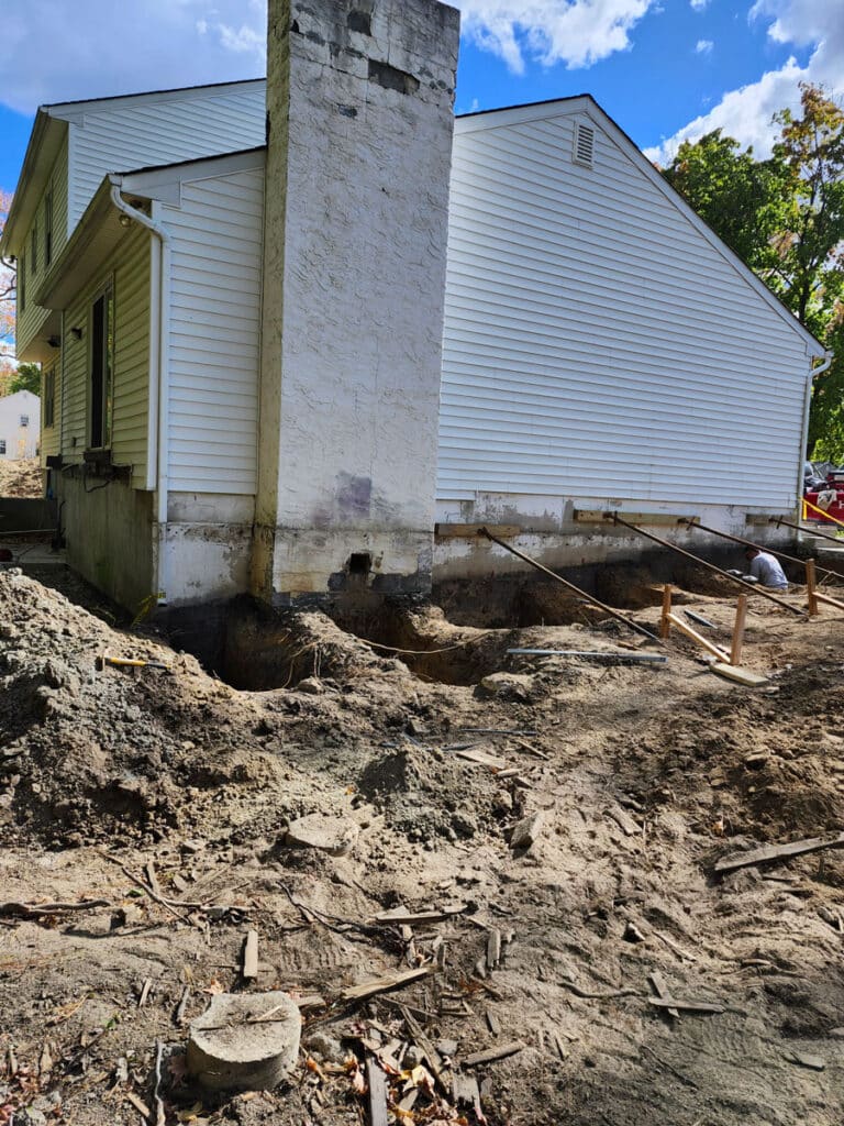 Exterior home with chimney in need of foundation repair