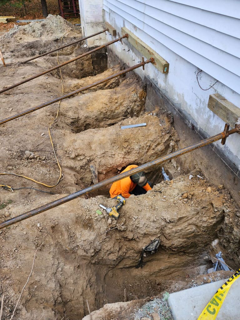 Deep underpinning is used to repair this foundation
