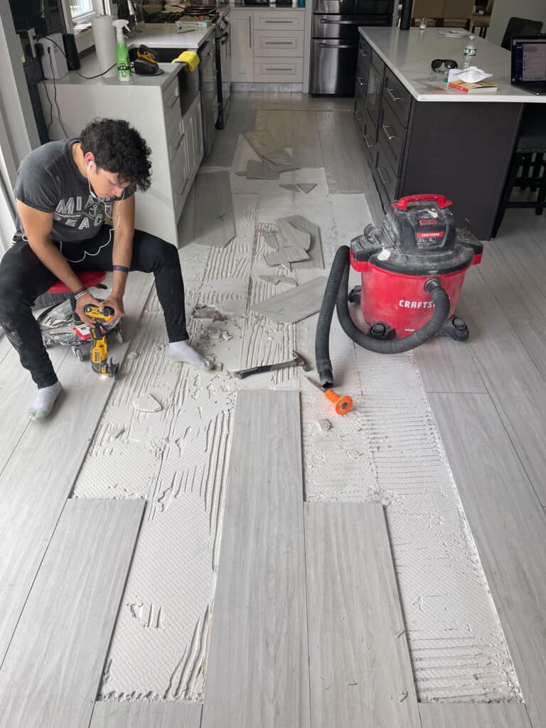 Large, heavy tile repair after cracked floors appeared.