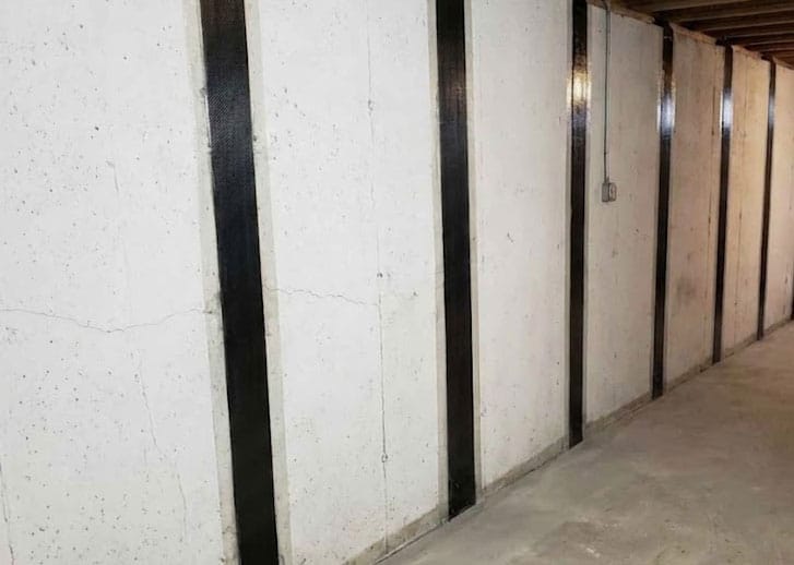 basement repair showing 6 strips of carbon fiber patching.