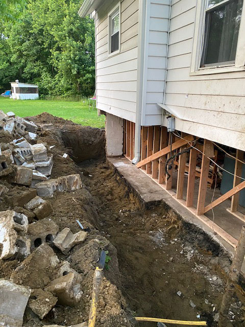Beginning a foundation repair - dug out around concrete.